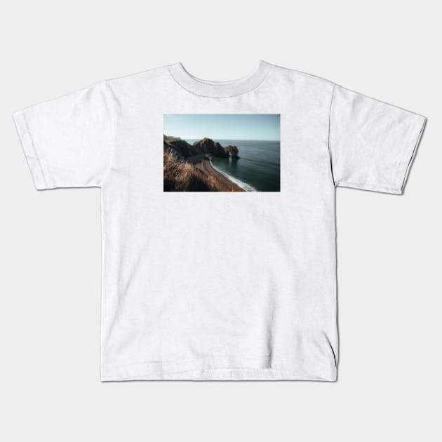 Durdle Door Beach Kids T-Shirt by withluke